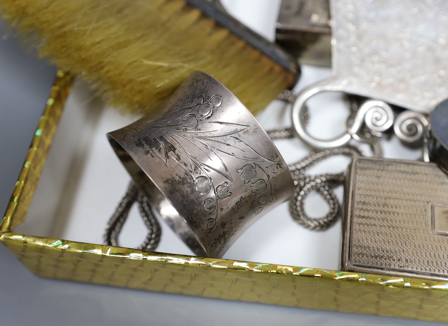 Assorted silver including a pierced bowl, pair of dwarf candlesticks, four condiments(a.f.), cigarette box, lid, 19th century snuff box and vinaigrette, match sleeve oval pill box, oval pepperette with handle and modern